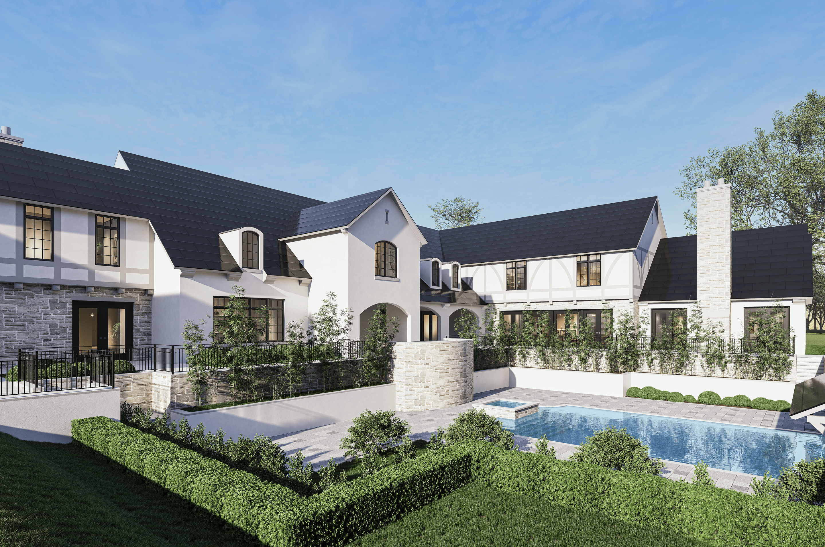 TESLA 3 A large white house with black roof shingles, featuring multiple gables, a chimney, and a rectangular pool surrounded by greenery.